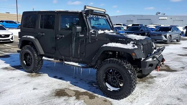 Used 2016 Jeep Wrangler Unlimited Rubicon with VIN 1C4BJWFG3GL203485 for sale in Waterford, MI