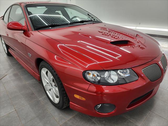2006 Pontiac GTO Base: TWO DOOR-POWER LEATHER-6 CD-BLAUPUNKT SOUND-AUTO-6.0L V8