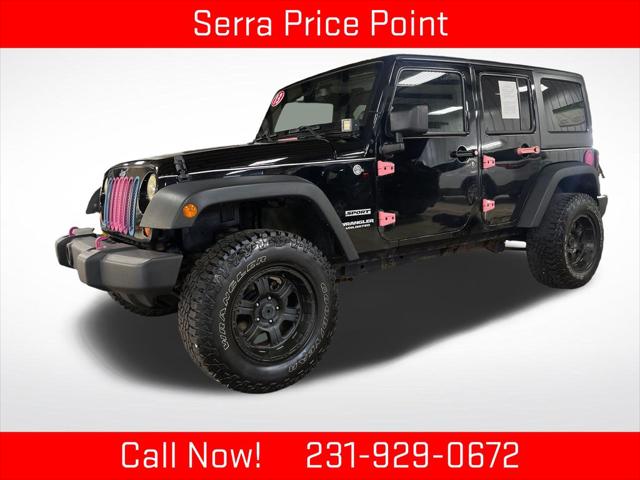 2013 Jeep Wrangler Unlimited Sport for sale in TRAVERSE CITY, MI